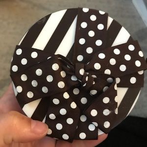 Set of 4 Henri bendel white and brown coasters